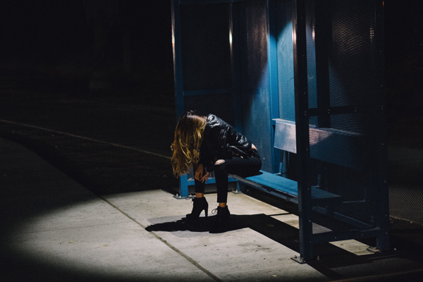 Woman at bus stop